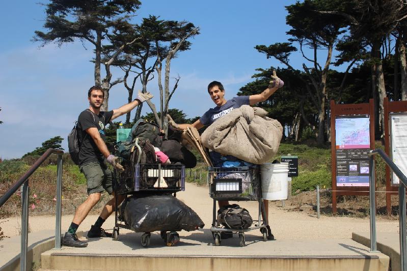 Showing off shopping carts full of collected trash at Land's